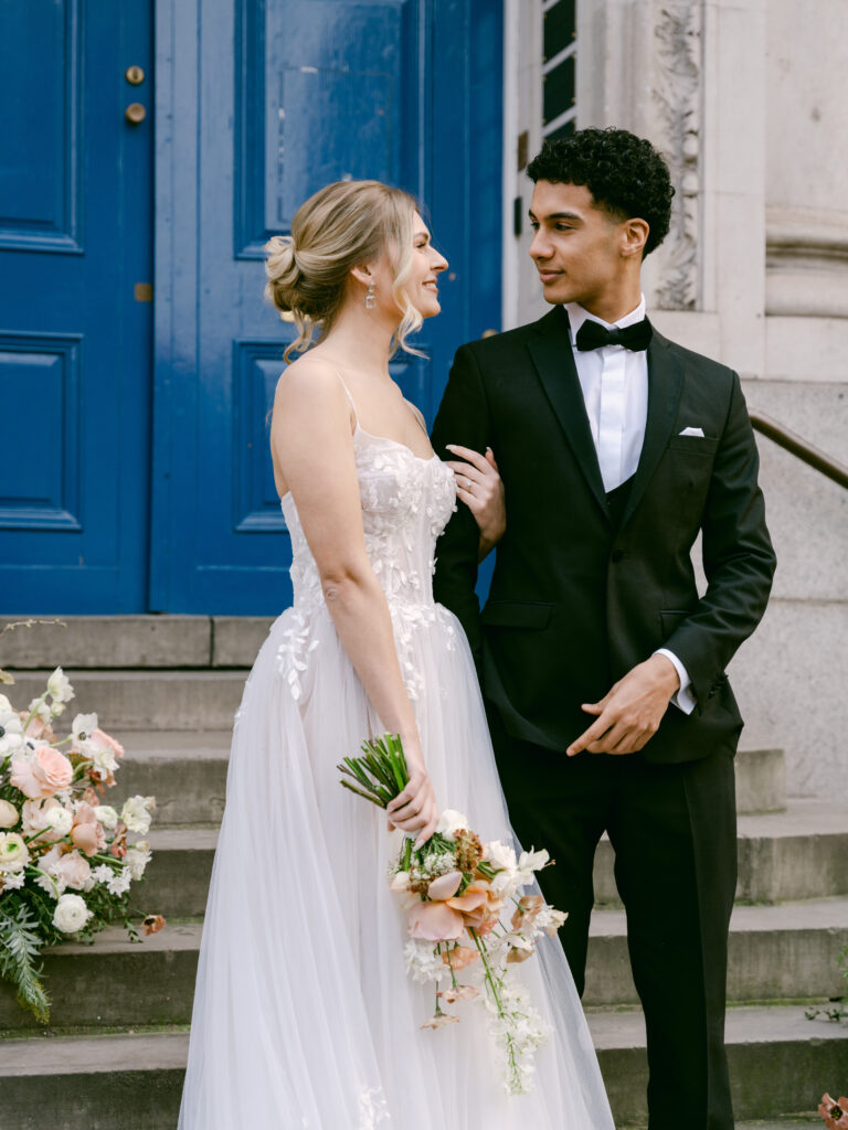 Photojournalistic style image of bride and groom exiting Chelsea Old Town Hall